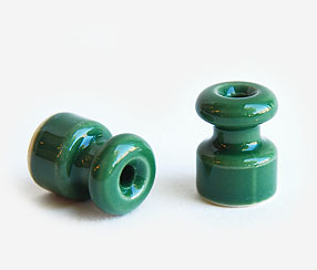 Ceramic wall fixing for twisted cables, green
